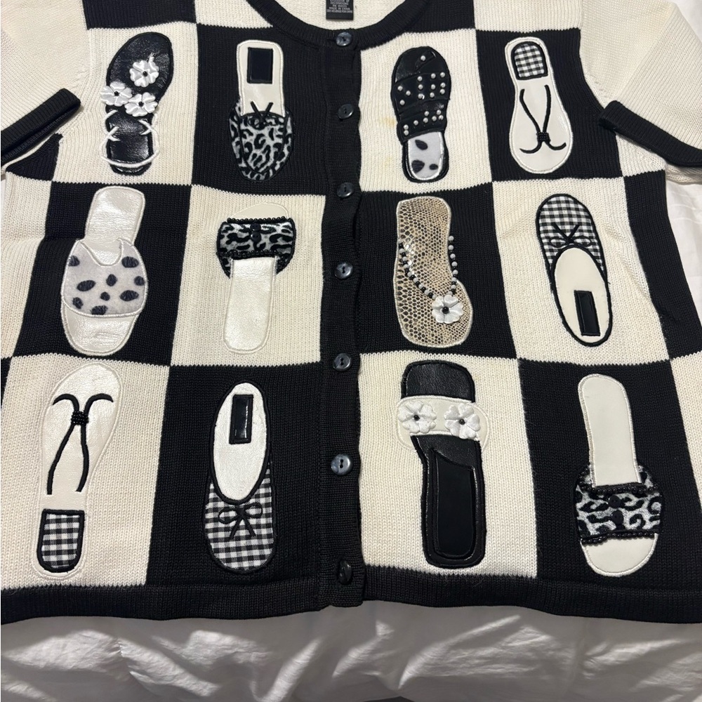 White and black sweater with black beach Accents